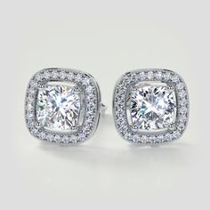 Give the ideal gift for any occasion with this exhilarating earring set. Divine simulated diamonds are enclosed by a gorgeous pave style halo with beaded milgrain to further embellish this set. A classic piece that shines with elegance.  Cushion Cut Beaded Halo Earrings Center Stone: 1.25CT Each Total Carat Weight: 2.76CTW Stone Clarity: VVS-1 Available in: 14K White Gold Model: ER2496-WH Silver Model, Halo Earrings, Halo Style, Gold Models, Diamond Set, Lab Diamonds, Cushion Cut, Round Cut, Earring Set