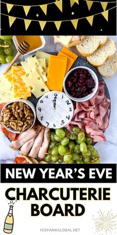 new year's eve charcuterie board with cheese, crackers and grapes