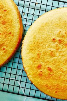 two cakes sitting on top of a cooling rack