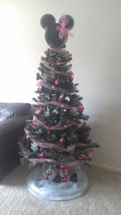 a decorated christmas tree with minnie mouse ears