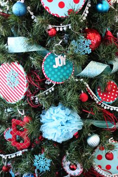 a christmas tree decorated with red, white and blue ornaments