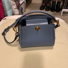 Cutest Satchel Bag In Brand New And Perfect Condition, Color Blue, Size 7.5w X 5.5h Blue Formal Satchel With Branded Hardware, Light Blue Formal Bags With Gold-tone Hardware, Formal Light Blue Bags With Gold-tone Hardware, Blue Office Satchel With Branded Hardware, Modern Blue Satchel With Branded Hardware, Light Blue Top Handle Shoulder Bag With Gold-tone Hardware, Blue Formal Bucket Bag, Formal Blue Bucket Bag, Light Blue Formal Crossbody Shoulder Bag