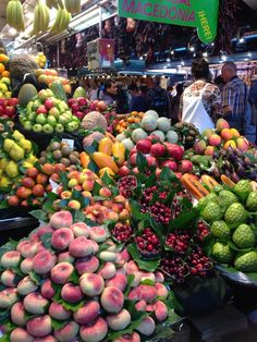 many different types of fruits and vegetables on display