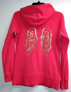 Victorias Secret Sequins Angel Wings Zip Up Hoodie Jacket Cotton / Polyester Size S/P Coral Orange All measurements are approximate. Armpit to armpit 18.5"  Waist side to side 16.5" Top to bottom 24.5" Bottom side to side 18.5" The zipper has a metal wings charm. The wings are gold. It has two front pockets and there is a pullstring on the hood. This is pre-owned and in great condition with no holes or stains. see photos * We ONLY ship within the United States. Victoria's Secret Hooded Hoodie For Fall, Victoria's Secret Casual Hooded Hoodie, Victoria's Secret Long Sleeve Hoodie For Fall, Victoria's Secret Long Sleeve Fall Hoodie, Victoria's Secret Cotton Sweatshirt For Fall, God Energy, Thrift Manifestation, Yellow Sweatpants, Pretty Fits