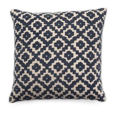 a black and white pillow with an intricate design on the front, sitting on a white background