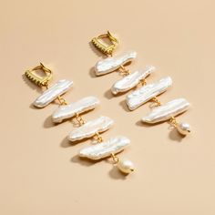 DETAILS Plating: 18K Gold Materials: 18K Gold on Brass, Cubic Zirconia, Freshwater Pearls Size: 3.19"*1.06"/81mm*27mm Weight: 5.4g/pr Slight variations due to the individuality of each piece Gold Baroque Single Earring, White Baroque Earrings For Party, Gold Baroque Earrings For Party, Pearl Jewelry Gift, Cat Pendant Necklace, Unique Gift Wrapping, Baroque Pearl Earrings, Horses Pendant, Prom Jewelry