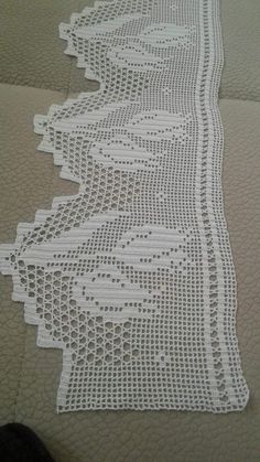 white crocheted table runner on the floor