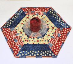 a red, white and blue plate sitting on top of a table