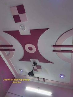 the ceiling is decorated in pink and white