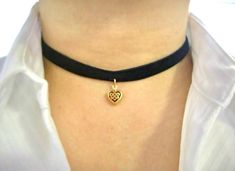 This item features: - a high quality Tierracast antique gold/ antique silver Endless Knot Heart  - 10mm black velvet ribbon or 2mm Black Leather cord  - stainless steel lobster clasp and additional 2" extender chain.  Heart charm measures 0.34"x0.37"(8.75x9.5mm) ♥ You might like the items below: https://www.etsy.com/ca/listing/1808401485/ https://www.etsy.com/ca/listing/1319741819/ https://www.etsy.com/ca/listing/264801750/ https://www.etsy.com/ca/listing/129748309/ ♥ Select your preferred lengt Endless Knot, Black Velvet Ribbon, Choker Black, Chain Heart, Leather Cord Necklace, Black Velvet Choker, Organza Pouch, Leather Corded Necklace, Heart Choker