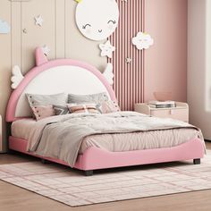 a child's bedroom with pink and white furniture, walls painted in pastel tones