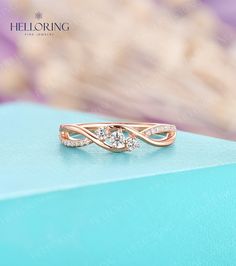 a diamond ring sitting on top of a blue box