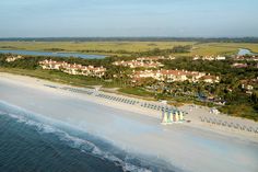 an aerial view of the beach and resort