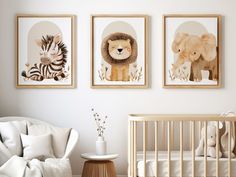 a baby's room with three framed pictures on the wall