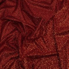 Grab glam Jessica Rabbit vibes with this Gala Fiery Red Double Faced Glitter Tulle! A red tulle base is adorned with bright red glitter on both sides, with one side showing a finer glitter than the other. The crisp hand and weighted drape make it an excellent choice for evening gowns, skirts, ball gowns, and bold capes, or use it for special occasion dresses, such as for weddings or quinceañeras. Opaque, a lining can be used for comfort if desired. Glamorous Red Sequin Fabric For Party, Glamorous Red Sequin Fabric For Evening, Glamorous Glitter Sequin Fabric For Festive Occasions, Glamorous Holiday Glitter Sequin Fabric, Glamorous Festive Sequin Fabric, Holiday Glamorous Sequin Fabric With Glitter, Glamorous Holiday Sequin Fabric With Glitter, Red Sequin Fabric For Holiday Parties, Christmas Party Sequin Glitter Fabric