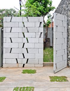 two cement blocks with grass growing in between them