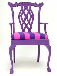 a purple chair with pink and blue stripes on the seat is against a white background