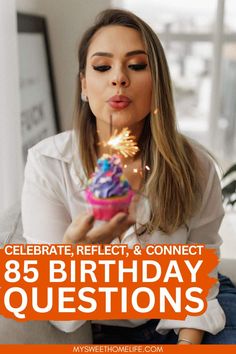 a woman blowing out candles on her birthday cake with the words celebrate, reflect and connect