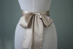 "An accessory to complement your beautiful wedding dress Made of satin fabric with flowers and belt made of satin. In the middle of the flower button is used the crystal. Flower size is approximately 5 \"dimensions. The belt length is approximately 80\"dimensions Flower fitted with lapel pins. Then, a flower can be used as a separate lapel pin. Please feel free to contact for questions and requests. PACKAGE ARE SENT BY FAST SHIPPING COMPANY WITHIN 3 TO 4 BUSINESS DAYS, TO UNITED STATES, TO CANAD Flower Wedding Dress, Wedding Dress Belt, Wedding Sash Belt, Wedding Dresses With Flowers, Flower Button, Belt Length, Wedding Belts, Dress Belt, Flower Wedding