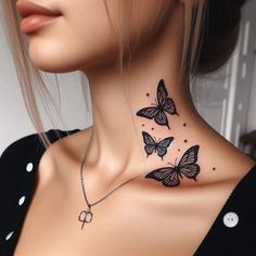 a woman's neck with three butterflies on it and the word love is written in black ink