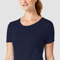 The comfortable and luxurious feel of the Wink Silky Short Sleeve Tee makes it a must-have layering piece. This modern tee is crafted in unbelievably soft rayon and spandex with an even longer, sleeker length for added coverage. Available in vibrant, trendy colors, the short sleeve tee pairs very well with Wink scrubs and is good for all occasions, from work to casual wear. Seamless Solid Elastane T-shirt, Solid Seamless Elastane T-shirt, Stretch Scoop Neck T-shirt For Layering, Solid Color Seamless Tops With Relaxed Fit, Seamless Tops With Relaxed Fit, Seamless Short Sleeve Tops For Layering, Stretch T-shirt For Layering, Comfortable Short Sleeve Tops, Classic Seamless Top In Solid Color