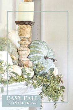 an easy fall mantel decoration with candles and gourds