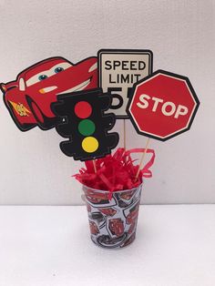 there is a cup with some candy in it and a sign on the top that says speed limit