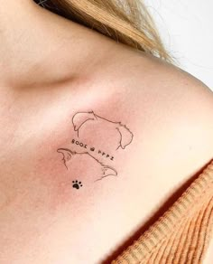 a woman with a tattoo on her shoulder that reads, do not feed the dog