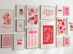 there are many framed pictures on the wall with red and white designs in them,