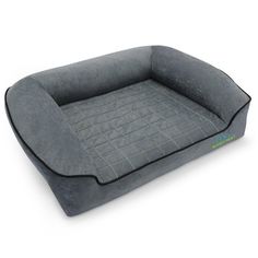 a dog bed that is made out of grey fabric