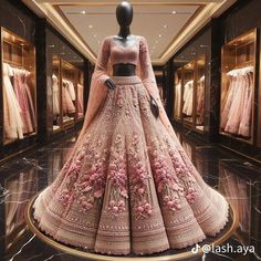 a mannequin is dressed in a pink and gold wedding dress with flowers on the skirt