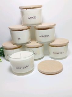 a group of white candles sitting next to each other