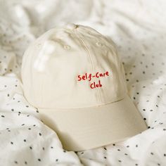 'Self-care club' embroidered cap is a must have accessory for any outfit. Whether you plan to go out on a sunny day or bringing it with you in case it rains, this cap will take care of you. While you spread the positive message and make everyone around you smile :) 🚚 SHIPPING 🚚 All of our items are made to order the moment you place your order and are never mass produced. All of the orders ship within 24-48h, in case of any exception or delays you will be notified. Embroidered Ball Cap, Minimal Shirt Design, Cool Baseball Caps, Self Love Club, Message Positif, Love Club, Embroidered Cap, Embroidered Caps, Positive Messages