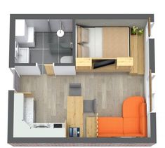 an overhead view of a studio apartment with one bed, sofa and kitchen in the background