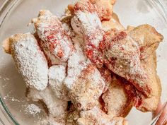 powdered sugar in a glass bowl on top of a table