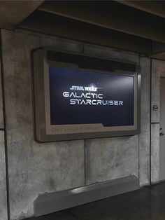 the star wars galactic starcruiser logo is displayed on a large screen