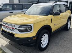 a yellow truck parked in a parking lot