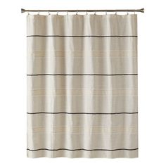 a white shower curtain with black stripes on the bottom and bottom, hanging from a metal rod