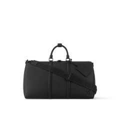 LOUIS VUITTON® - Keepall Bandoulière 50 - Black Luxury Black Bag With Luggage Sleeve, Luxury Black Travel Bag With Leather Handles, Classic Black Luggage With Leather Trim, Luxury Black Duffle Bag For Formal Occasions, Black Luxury Duffle Bag For Formal Occasions, Luxury Black Luggage With Adjustable Strap, Designer Black Duffle Bag With Luggage Sleeve, Black Designer Duffle Bag For Formal Occasions, Designer Black Luggage With Sleeve