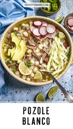 a bowl filled with meat, cabbage and radishes next to sliced limes