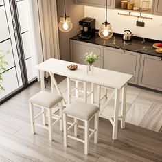 a white table and chairs in a room