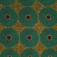 an image of a green and yellow pattern with circles in the center on a black background