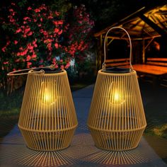 two yellow lanterns sitting next to each other