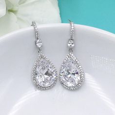 "Add brilliant sparkle with these classically designed framed cubic zirconia teardrop wedding earrings set in brilliant rose gold. Measuring 1 1/4\" long, these are perfect for any special occasion. Earrings feature a CZ encrusted French hook with a dangling teardrop for a truly unique look! Can be ordered in yellow gold or silver as well. Optional matching pendant measures 16\"-18\" (adjustable). All jewelry features high quality electroplating that does not fade or chip and is nickel free (hyp Rose Gold Jewelry Set, Rose Gold Bridal Earrings, Bridal Jewellery Earrings, Gold Earrings Wedding, Gold Bridal Earrings, Bridesmaid Gifts Jewelry, Crystal Headpiece, Gold Jewelry Sets, Cubic Zirconia Earrings