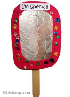 an image of a hand made mirror on a wooden stick with tin foil over it