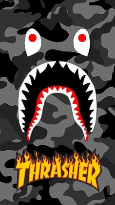 an image of a camo background with a shark's mouth and flames on it