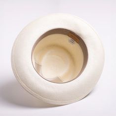 This bleached white panama fedora is a real looker. It has a teardrop crown and features wire in the brim for minor shape adjustments. Brim can be worn as shown in the picture or "snapped" up. It comes finished with a 16-Ligne grosgrain ribbon around the crown, a discrete bow and a removable Scala emblem. Additional information: Scala Panamas come with an "uncrushable" insert in the crown which prevents cracking from normal wear and tear. In addtion they come finished with a tefllon coating to repel mild water and oil based spills. Brim: 2 5/8" Crown: Front: 4" Side: 4 1/2" Upf Clothing, Outback Hat, Grade 3, Fedora Hat, Hat Sizes, Grosgrain Ribbon, The Crown, Face Shapes, Panama