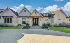 a large house with stone and stucco exterior