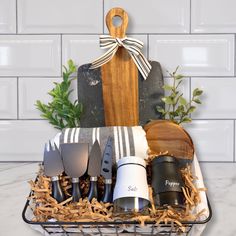 a basket filled with kitchen utensils sitting on top of a counter next to a cutting board