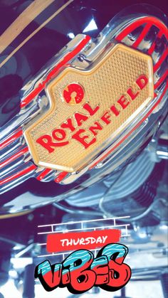 the royal enfield motorcycle logo is shown on it's chrome and red paint scheme